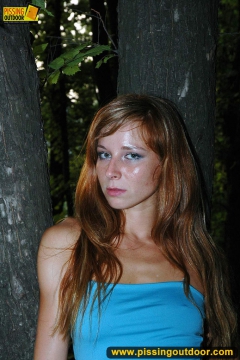 Outdoor pissing in the night of teen redhead girl