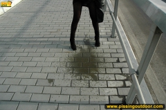 Outdoor pissing of teen blonde in the city street - N