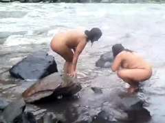 two-indian-mature-womens-bathing-in-river-naked